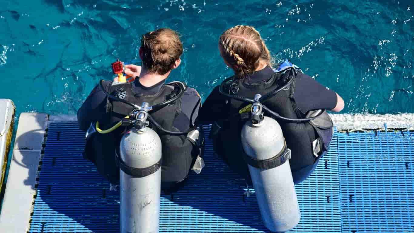 Two girls ready to dive